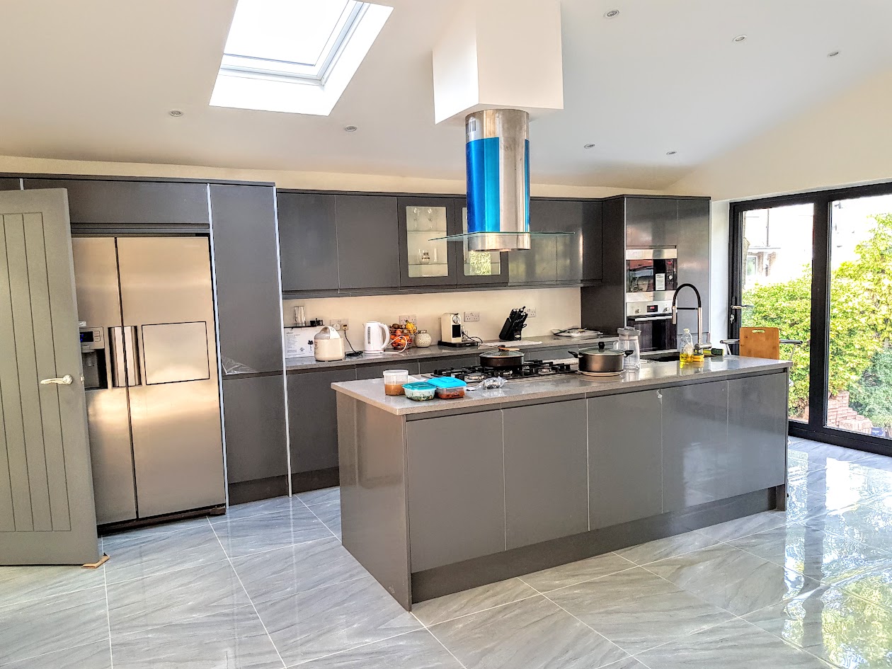 Bright grey kitchen refurbishment with skylights